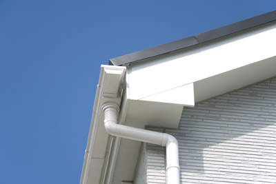 White rain gutter on home. Master Roofing Inc provides quality rain gutter installation in Vancouver WA.